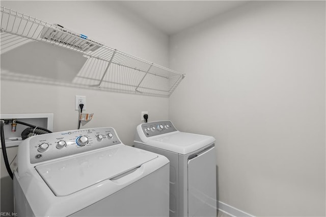 washroom with separate washer and dryer