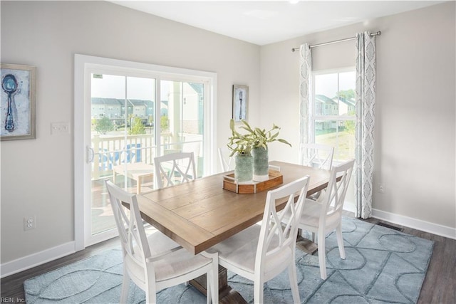 dining area featuring dark hardwood / wood-style floors and a wealth of natural light