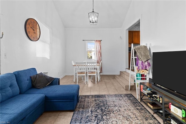 living room with a notable chandelier, vaulted ceiling, and light tile patterned floors