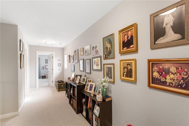 hallway with light carpet