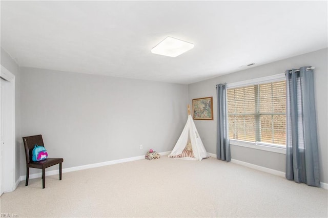 playroom featuring light colored carpet