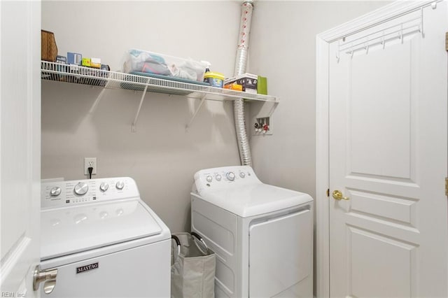 washroom featuring washer and dryer