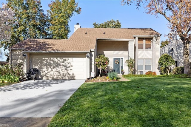 view of front facade featuring a garage and a front yard