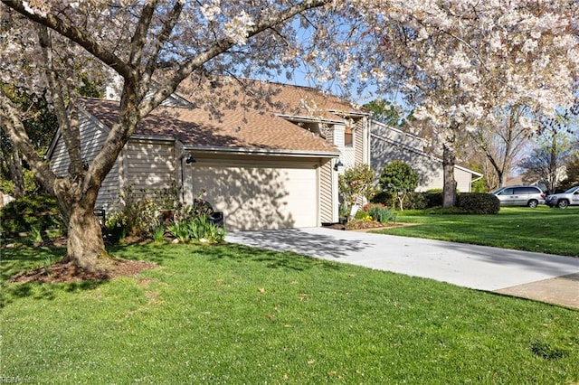 view of front facade featuring a garage and a front yard