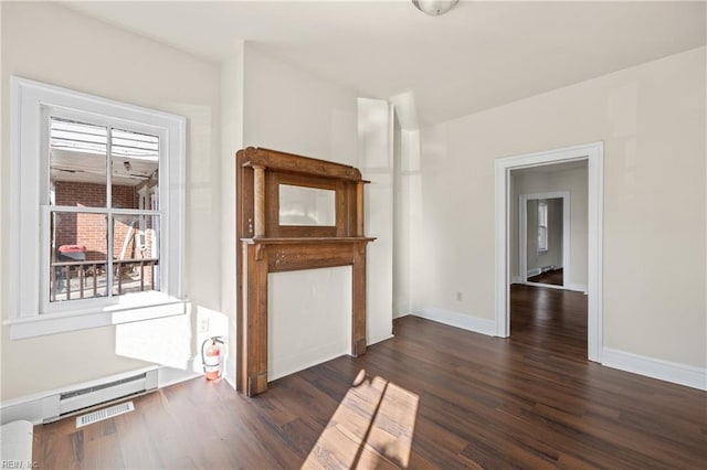 unfurnished living room featuring dark wood-type flooring