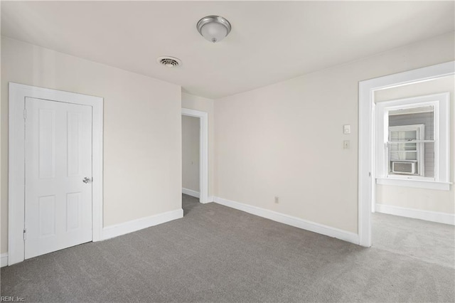 unfurnished room featuring carpet