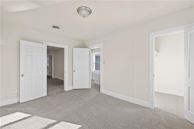 unfurnished bedroom with light carpet