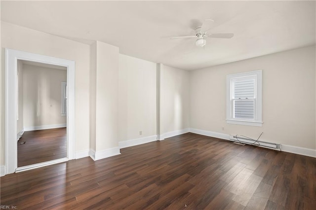 unfurnished room featuring dark wood-type flooring, a baseboard radiator, and ceiling fan