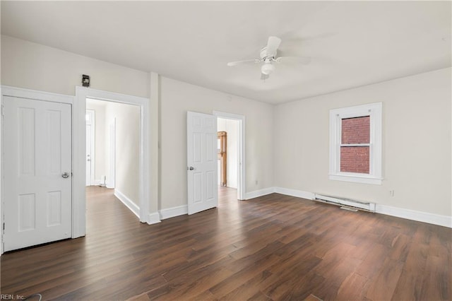 unfurnished room featuring a baseboard heating unit, dark wood-type flooring, and ceiling fan