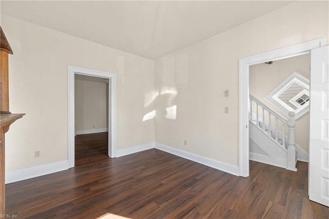 unfurnished living room featuring dark hardwood / wood-style flooring