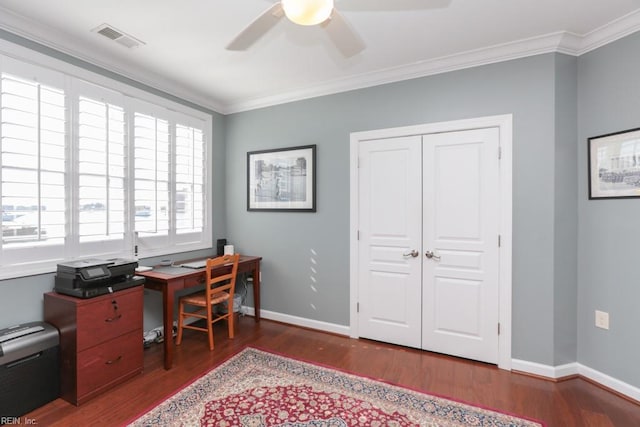 home office with dark wood-type flooring, ceiling fan, and ornamental molding