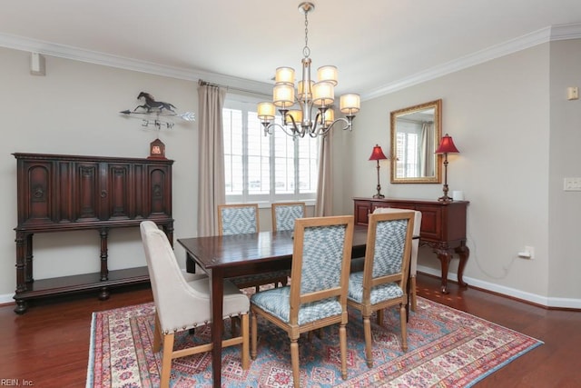 dining area with dark hardwood / wood-style flooring, crown molding, and a chandelier