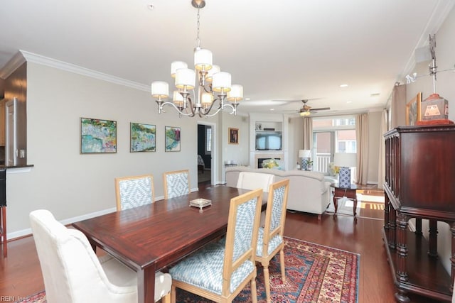 dining room with ceiling fan with notable chandelier, crown molding, and dark hardwood / wood-style flooring