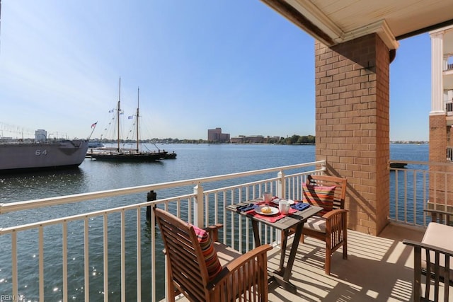 balcony featuring a water view