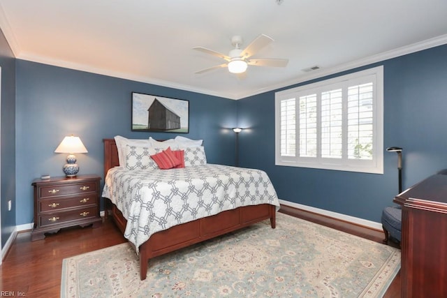 bedroom with ceiling fan, dark wood-type flooring, and ornamental molding