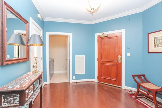 interior space with wood-type flooring and ornamental molding