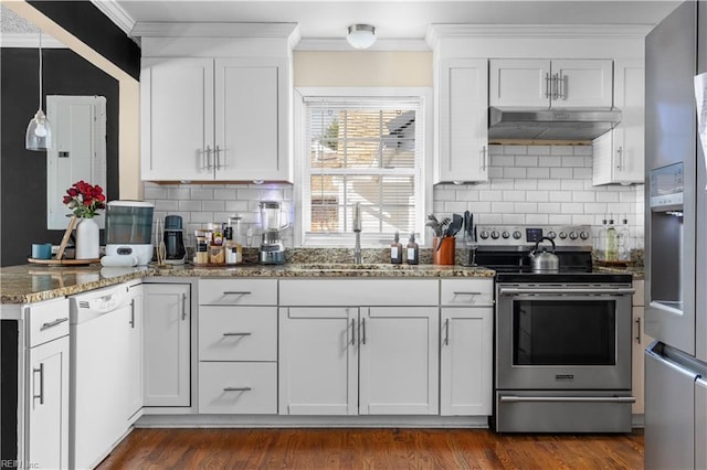 kitchen featuring stainless steel appliances, white cabinetry, sink, and decorative backsplash