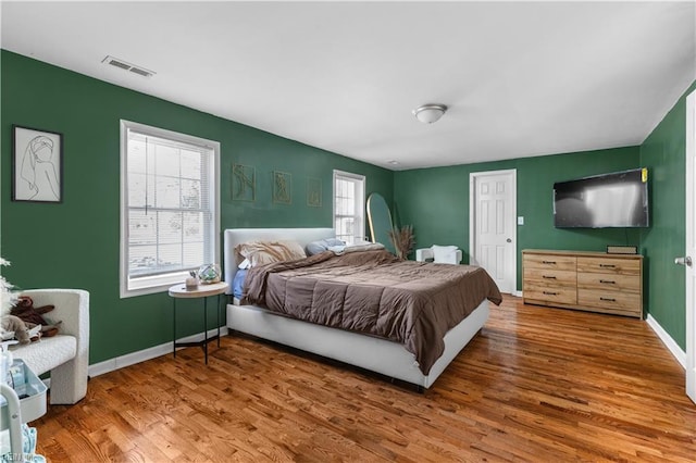 bedroom with wood-type flooring