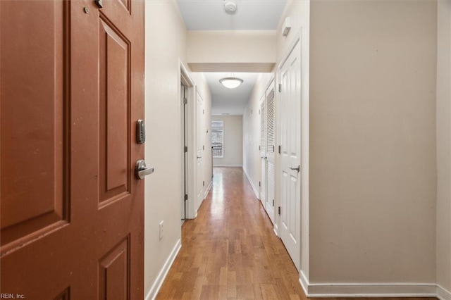 hallway with light wood-type flooring