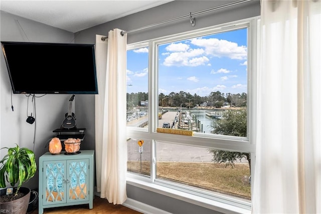 doorway to outside with a water view