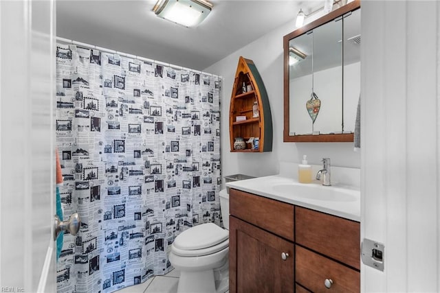 bathroom featuring vanity, toilet, curtained shower, and tile patterned flooring