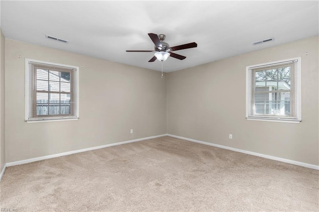 carpeted empty room with ceiling fan