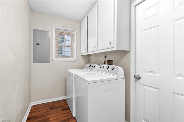 washroom featuring dark wood-type flooring, cabinets, electric panel, and independent washer and dryer