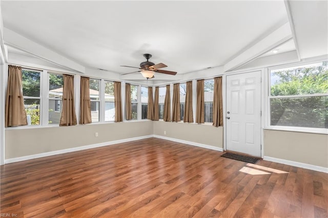 unfurnished sunroom with ceiling fan