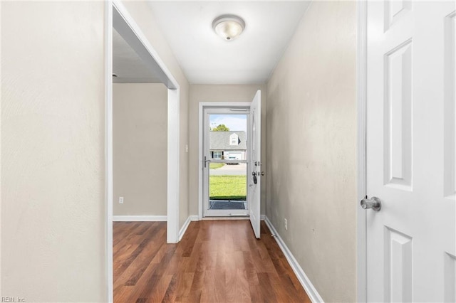 doorway to outside with dark hardwood / wood-style flooring