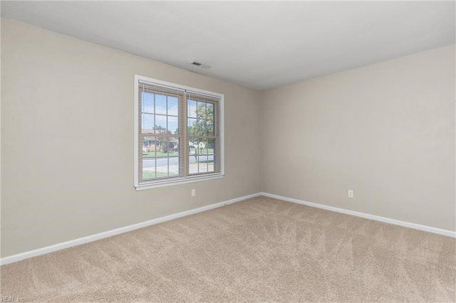 unfurnished room with carpet flooring