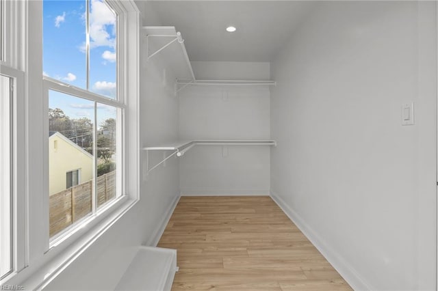 walk in closet featuring light wood-type flooring