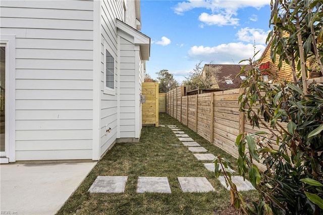 view of yard with a fenced backyard