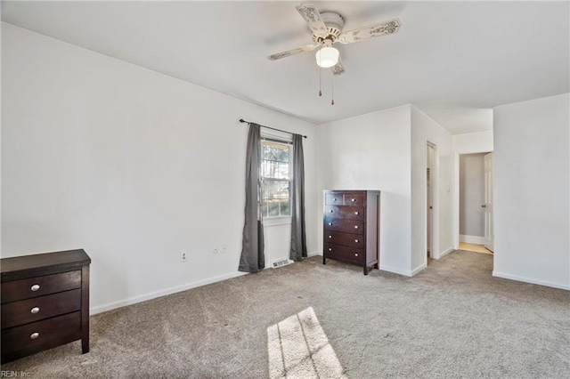 unfurnished bedroom featuring ceiling fan and light carpet