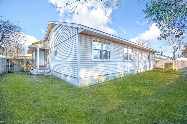 view of side of property with a yard