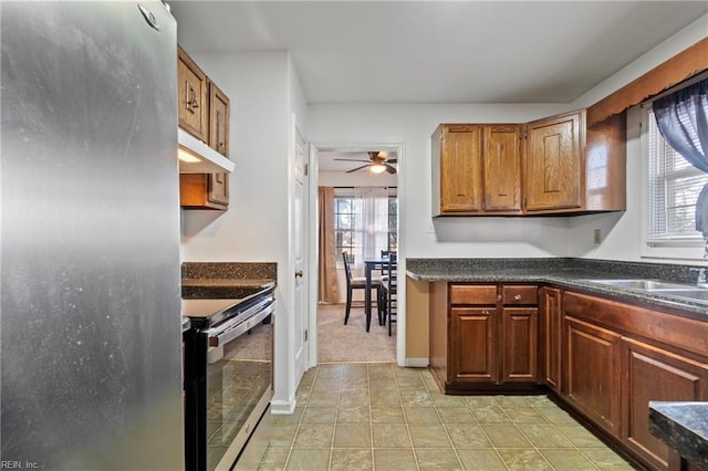 kitchen with sink, ceiling fan, and stainless steel appliances