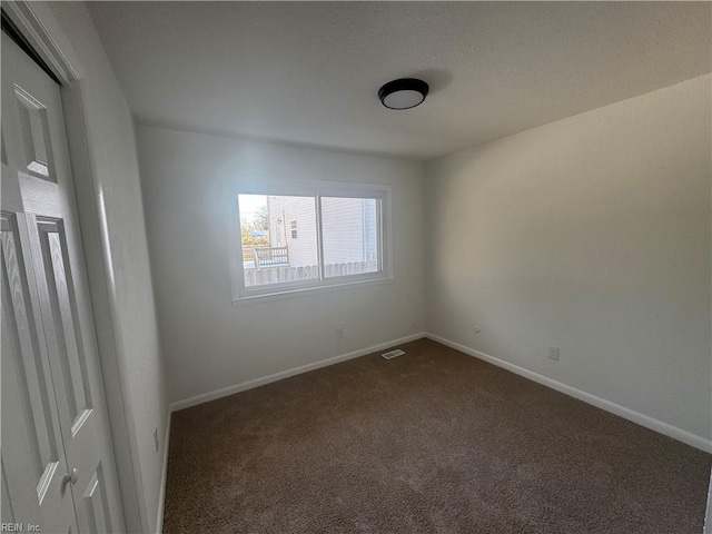 view of carpeted spare room