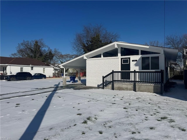 view of home's exterior with a carport