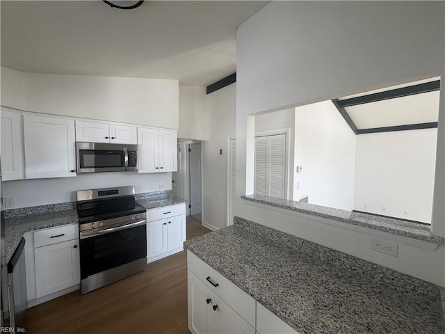 kitchen featuring white cabinets, appliances with stainless steel finishes, dark hardwood / wood-style floors, high vaulted ceiling, and stone counters