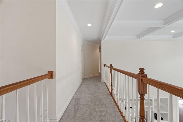 hall with coffered ceiling, light colored carpet, beamed ceiling, and ornamental molding