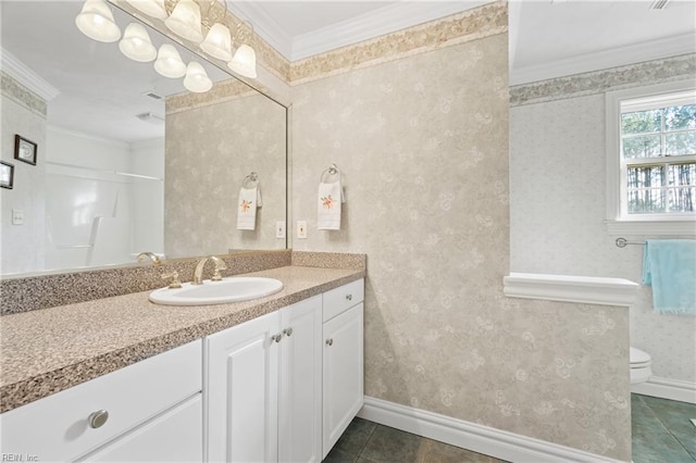 bathroom featuring toilet, vanity, tile patterned floors, and ornamental molding