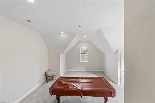 recreation room with light carpet and lofted ceiling