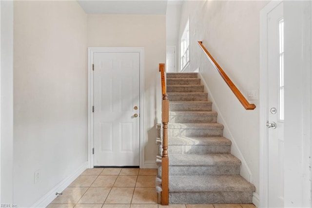 stairs with tile patterned flooring