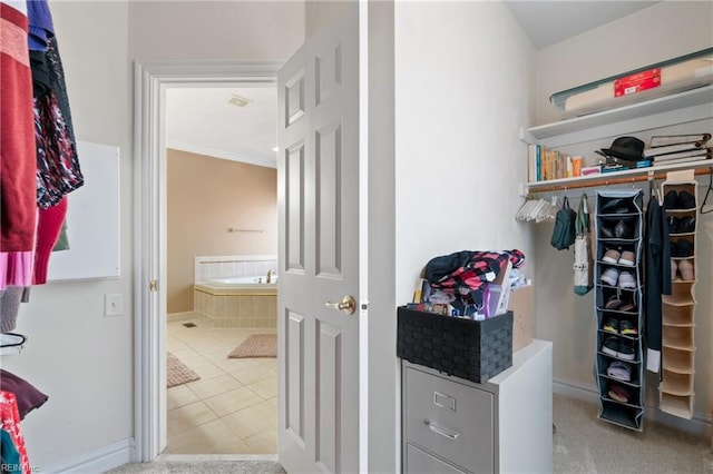 walk in closet featuring light tile patterned floors