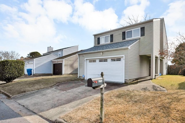 front facade featuring a garage and a front lawn