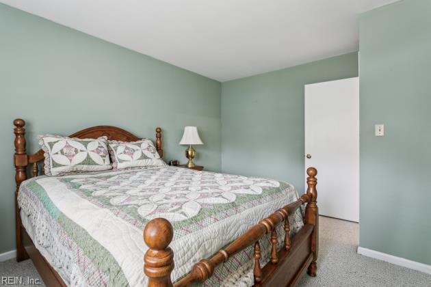 bedroom with light carpet