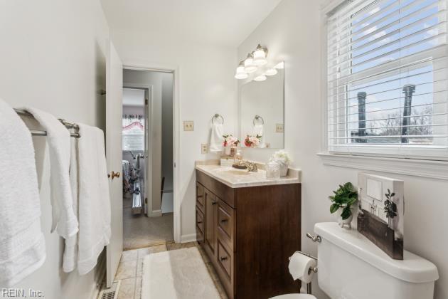 bathroom with toilet and vanity