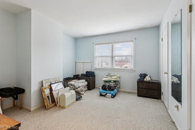 miscellaneous room featuring light carpet