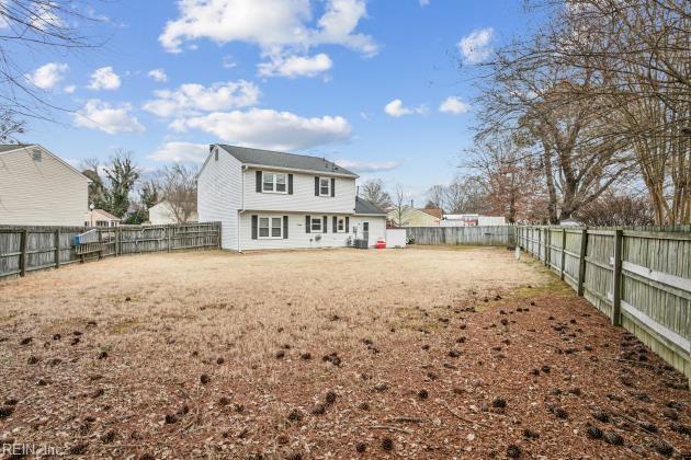 rear view of house with a lawn