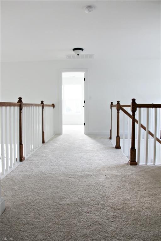 hallway with carpet flooring