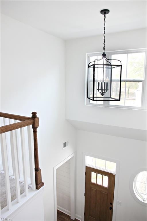 foyer with a chandelier